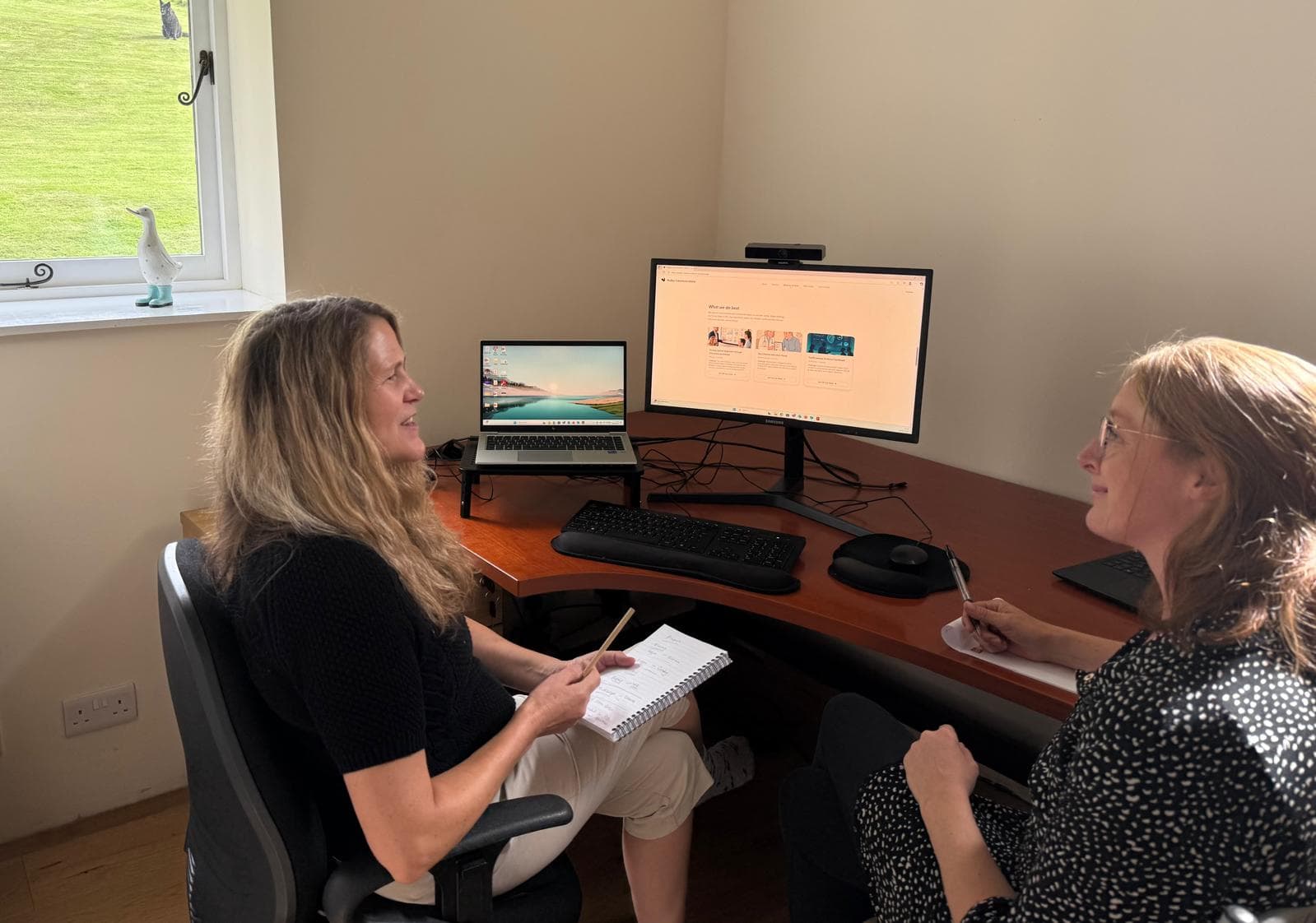 Sally and Sam working at the desk